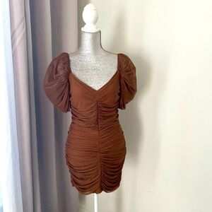 Cinched chocolate lace dress with structured puff sleeves.